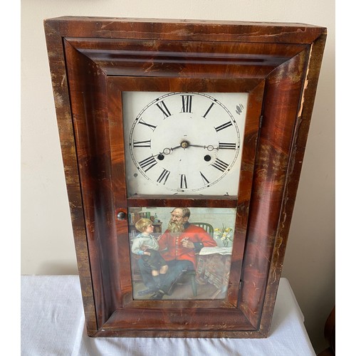 934 - An American Seth Thomas wall mounted cased clock with walnut veneer and Victorian print to door pane... 