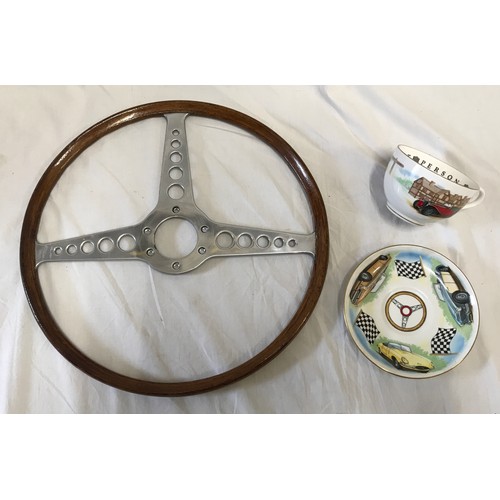 939 - A vintage wood steering wheel 40.5cm d and a Royal Worchester cup and saucer with vintage cars desig... 
