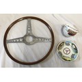 A vintage wood steering wheel 40.5cm d and a Royal Worchester cup and saucer with vintage cars desig... 