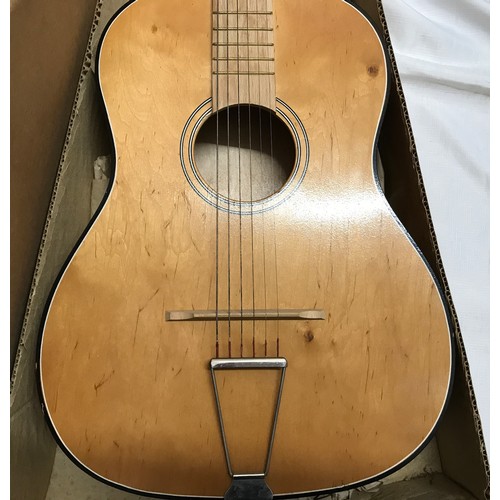 949 - A 1960's/70's acoustic guitar possibly Hornby make with packaging box.