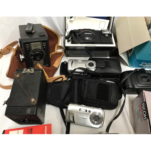 958 - Collection of cameras including 2 old Conway and a box camera, Modern Ricoh, Olympus, Praktika, Pola... 