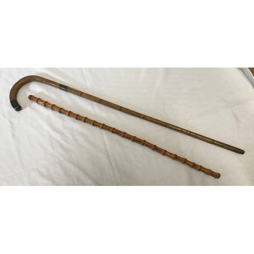 960 - Two walking sticks. One with silver collar and tip Birmingham 1922-93cm L and one hazlewood cane 80 ... 