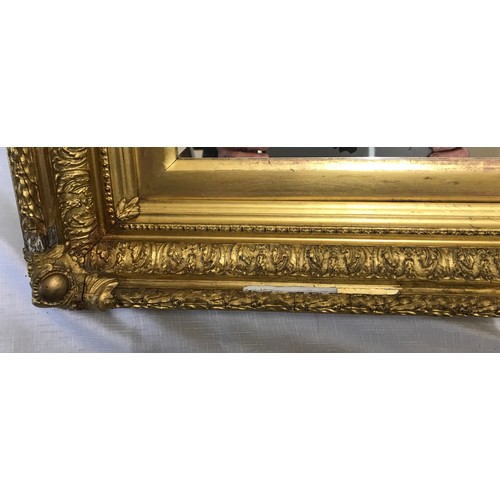 963 - Large decorative gilt framed bevel edged wall mirror.
Mirror size 70cm x 47cm. Frame size 91cm x 68c... 