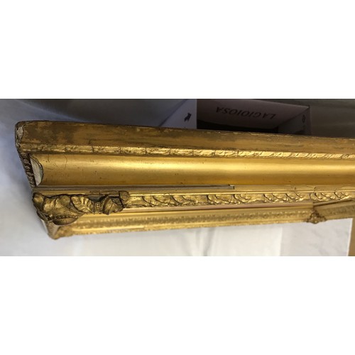 963 - Large decorative gilt framed bevel edged wall mirror.
Mirror size 70cm x 47cm. Frame size 91cm x 68c... 