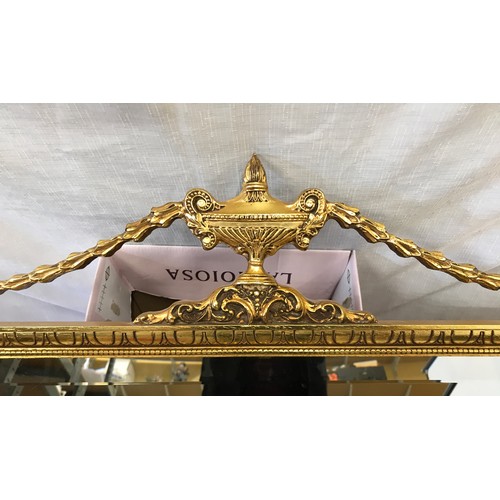 964 - Large decorative gilt framed bevel edged wall mirror with decorative bow frame.
 Mirror size 87cm x ... 