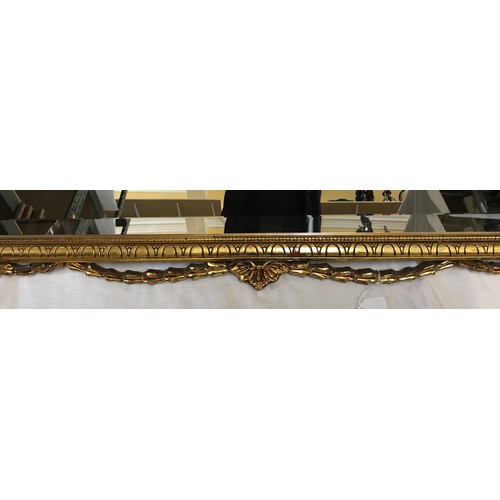 964 - Large decorative gilt framed bevel edged wall mirror with decorative bow frame.
 Mirror size 87cm x ... 