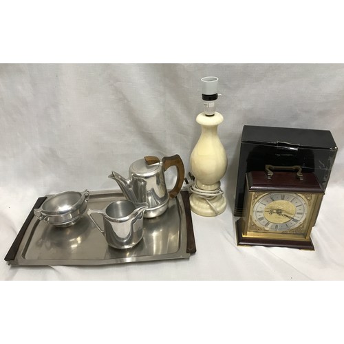 968 - Picquot three piece tea set on steel tray, an onyx table lamp 33cm h and a Metamec chiming mantle cl... 