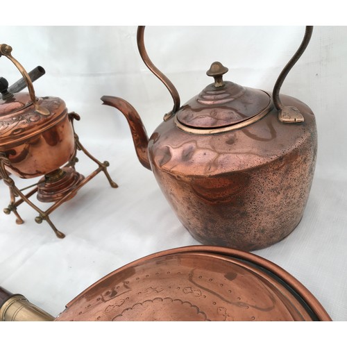 969 - A collection of copper to include a spirit kettle 28cm, a large kettle 31cm, a double saucepan 17cm ... 