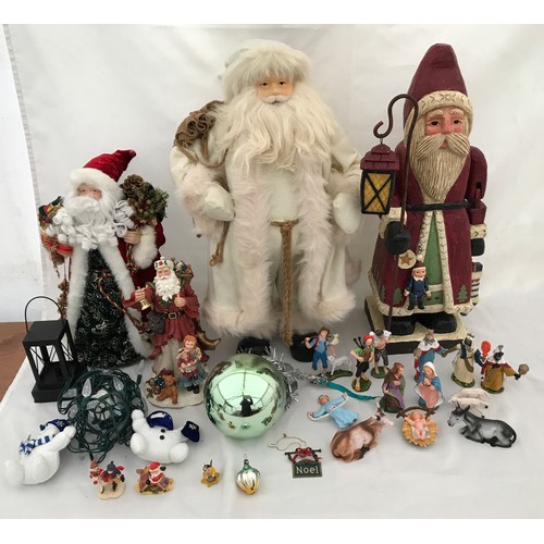 971 - Christmas decorations to include a large wooden Santa 60cm, a Santa in a white coat 62cm, a small Sa... 