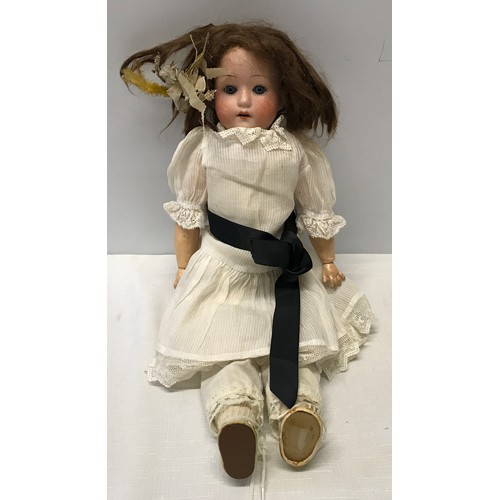 975 - A German pot headed doll stamped to back of the head, with a composite articulated body. Approx 42cm... 