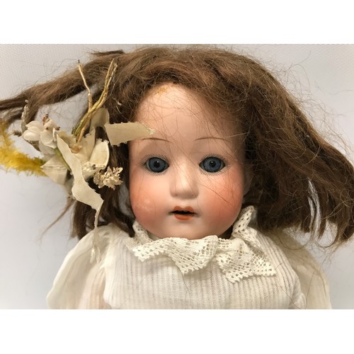 975 - A German pot headed doll stamped to back of the head, with a composite articulated body. Approx 42cm... 