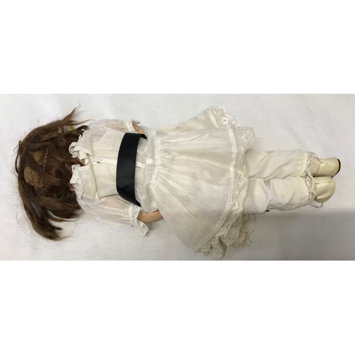 975 - A German pot headed doll stamped to back of the head, with a composite articulated body. Approx 42cm... 