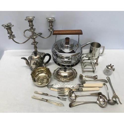 1051 - A collection of silver plate wares to include a candelabra 28cm, teapot, muffin dish, toast rack, la... 