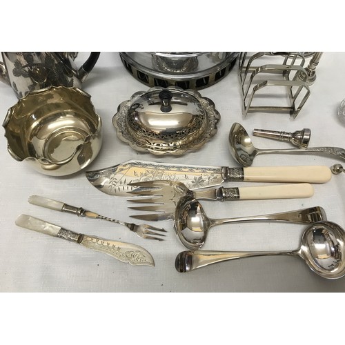 1051 - A collection of silver plate wares to include a candelabra 28cm, teapot, muffin dish, toast rack, la... 