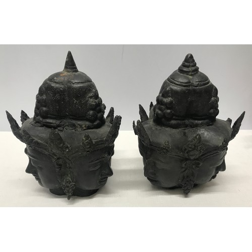 1054 - Pair of Tibetan bronze three headed busts 21cm h x 15cm w.