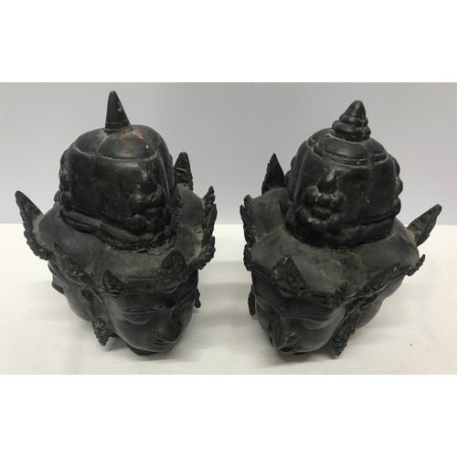 1054 - Pair of Tibetan bronze three headed busts 21cm h x 15cm w.