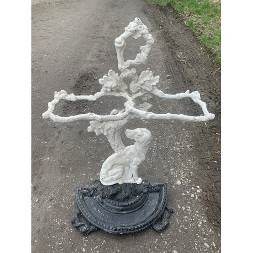 1057 - A painted cast iron stick stand of gundog and oak tree.
70cms h x 41cms w.