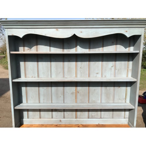 A light blue painted pine welsh dresser with 3 drawers, 3 cupboards and  back with 3 shelves. 132cm w
