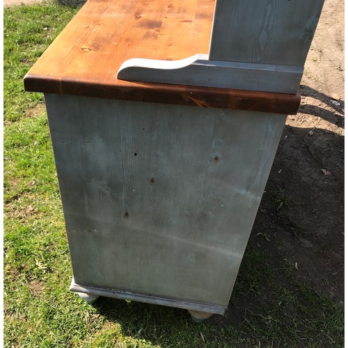 A light blue painted pine welsh dresser with 3 drawers, 3 cupboards and  back with 3 shelves. 132cm w