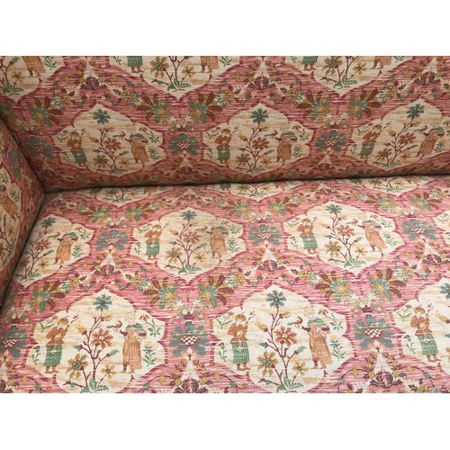 1503 - A mahogany framed floral upholstered wing back sofa. 200 w x 65 d x 90cms h.