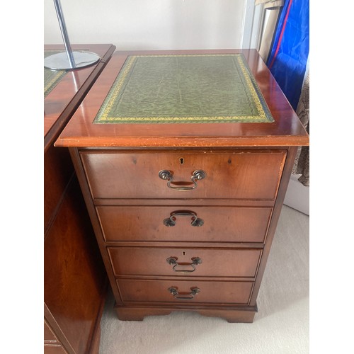 1504 - A 20thC yew wood pedestal desk with green tool leathered top and brass drop handles  and drawers to ... 