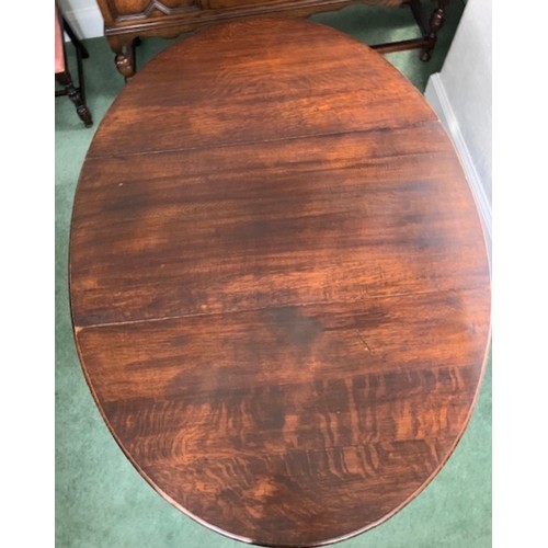 1505 - An oak barley twist drop leaf dining table, open 107 x 147cms, leaves down 107 x 52 x 72cms h.