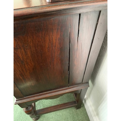 1507 - An oak two height dresser, cupboards and drawers to base, shelves and cupboards to top. 159 h x 152 ... 