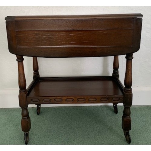 1508 - An oak trolley with drop leaves . Down 68 x 43cms, up 68 x 80 x 73cms.