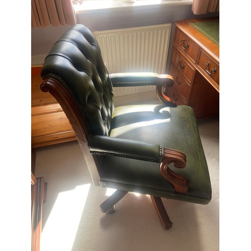 1510 - A 20thC button backed leather swivel desk chair.