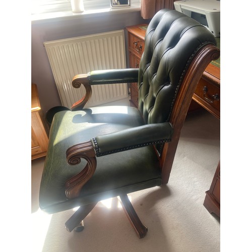 1510 - A 20thC button backed leather swivel desk chair.