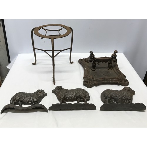 1513 - A collection of cast iron to include three sheep door stops 23.5cm l x 16.5cm w x 6cm, an ornate boo... 