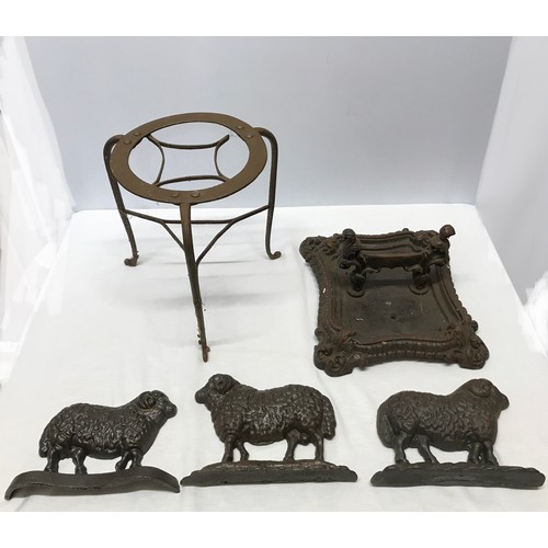 1513 - A collection of cast iron to include three sheep door stops 23.5cm l x 16.5cm w x 6cm, an ornate boo... 