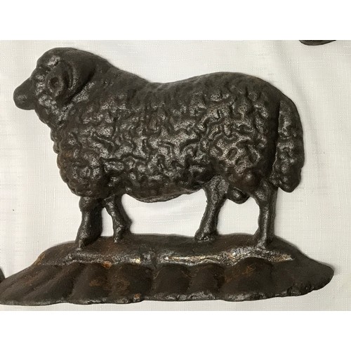 1513 - A collection of cast iron to include three sheep door stops 23.5cm l x 16.5cm w x 6cm, an ornate boo... 