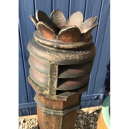 1515 - A tall crowned brown glazed chimney pot 106cm, a small limestone chimney pot 55cm and a large stonew... 