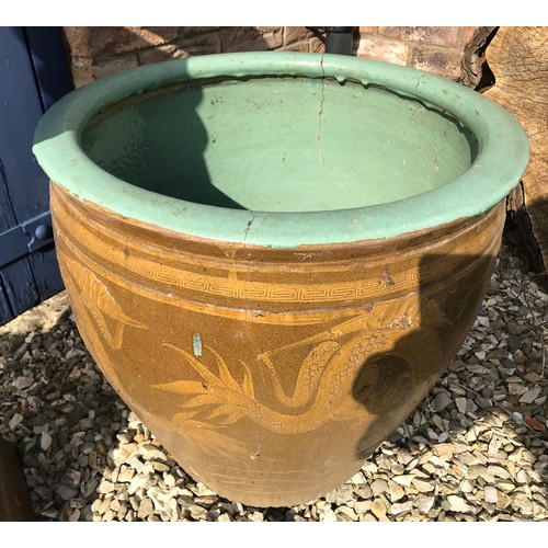 1515 - A tall crowned brown glazed chimney pot 106cm, a small limestone chimney pot 55cm and a large stonew... 