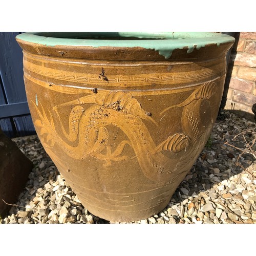 1515 - A tall crowned brown glazed chimney pot 106cm, a small limestone chimney pot 55cm and a large stonew... 