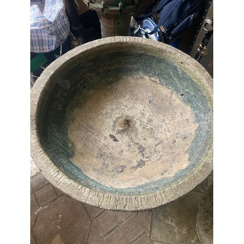 1516 - A large reconstituted stone bird bath on a pedestal base. 80cms x 64cms h.