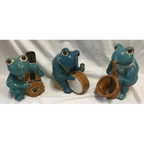 1521 - Large glazed pottery garden ornaments of a frog band x 3 to include saxophone, bass and drum. Talles... 