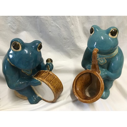 1521 - Large glazed pottery garden ornaments of a frog band x 3 to include saxophone, bass and drum. Talles... 