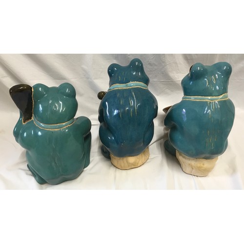 1521 - Large glazed pottery garden ornaments of a frog band x 3 to include saxophone, bass and drum. Talles... 