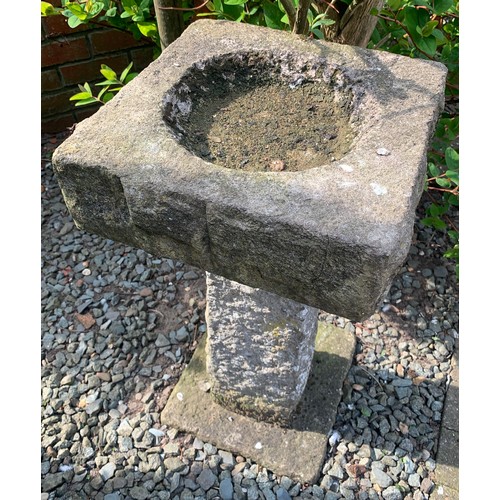 1532 - A Stone bird bath, 68cms h x 32cms square base.