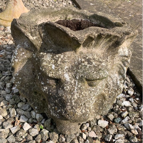 1534 - A reconstituted stone garden planter in the form of a lions head, 29cms h.