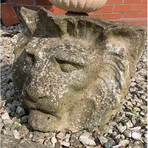 1534 - A reconstituted stone garden planter in the form of a lions head, 29cms h.