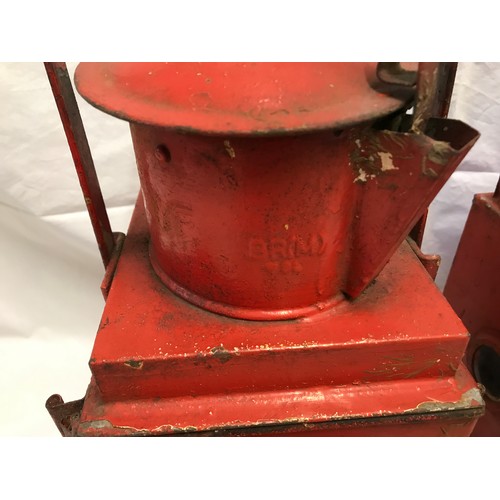 1535 - A pair of railway lamps, red, one with BR stamp British Railway, height including handle 53cms h.