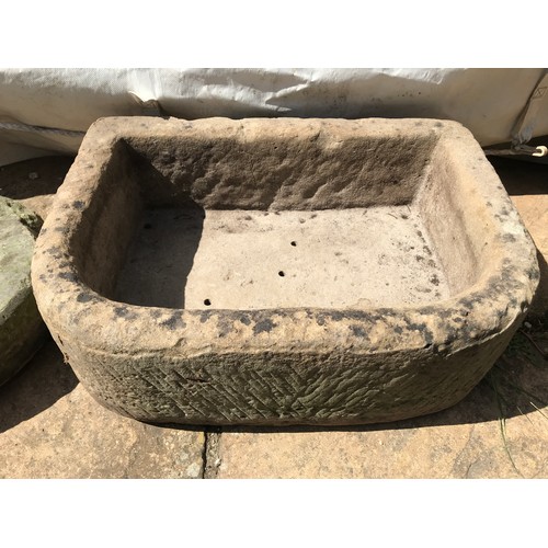 1541 - Limestone planter 56cms w x 40cms x l x 19cms h together with a craved circular limestone with cross... 