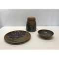 A 3 piece collection of studio pottery with purple and green glazed design to include a biscuit barr... 