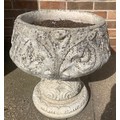 A single reconstituted stone urn. 46cms h x 43cms d.