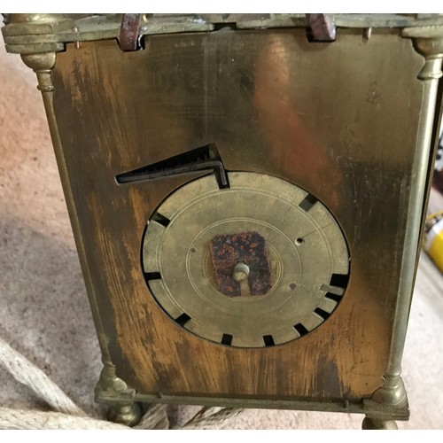 924 - An old reproduction lantern clock with pulley, weight and wooden corner mounted shelf. A single poin... 