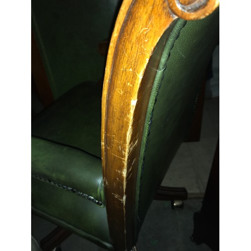 1510 - A 20thC button backed leather swivel desk chair.