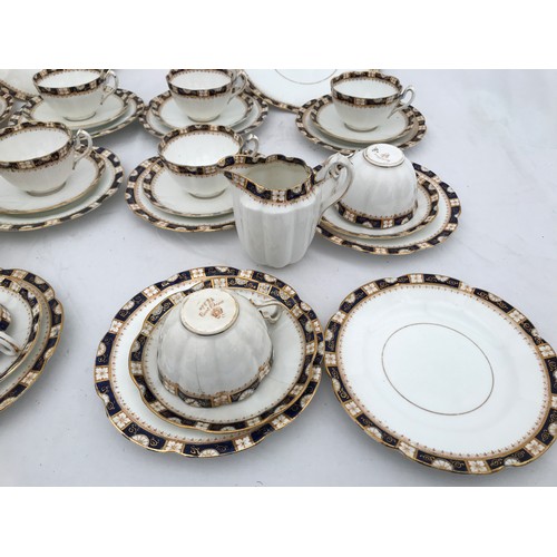 67 - A part tea set of Court China W.L.L. blue and gilt. Thirty eight pieces comprising : 2 cake plates 2... 